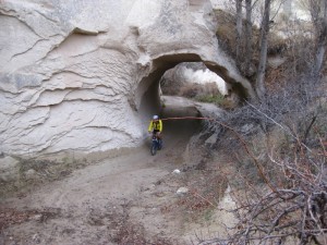 Scott biking through a tunnel.